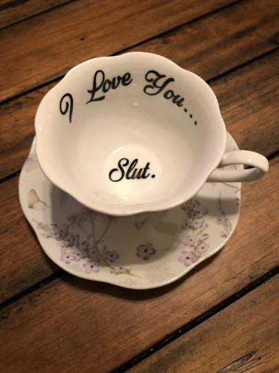 novelty coffee cup with design -I love you... Slut. | Vulgar lavender tea cup with matching 'Slut.' saucer